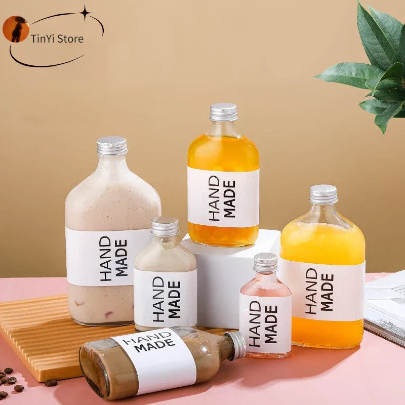 DecorBites™ Clear Glass Beverage Bottles: Reusable for Juicing, Smoothies, Kombucha, Tea, Milk, and Wine