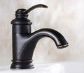 DecorBites™ Antique Brass Single Handle Deck Mount Bathroom Sink Faucet.