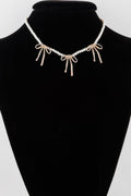Pearl And Metal Ribbon Charm Necklace