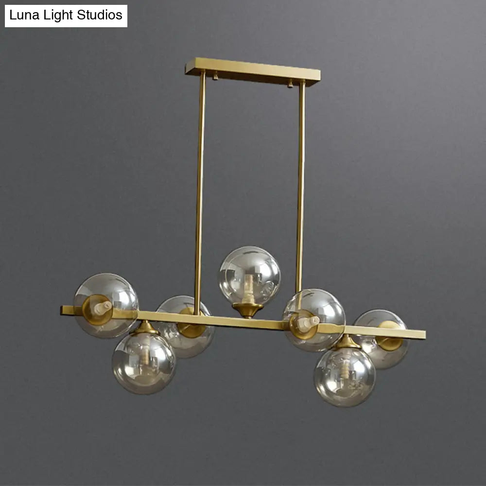 DecorBites™ Mid-Century Modern Gold Metal Pendant with Spherical Amber Glass - Island Ceiling Light for Dining Table