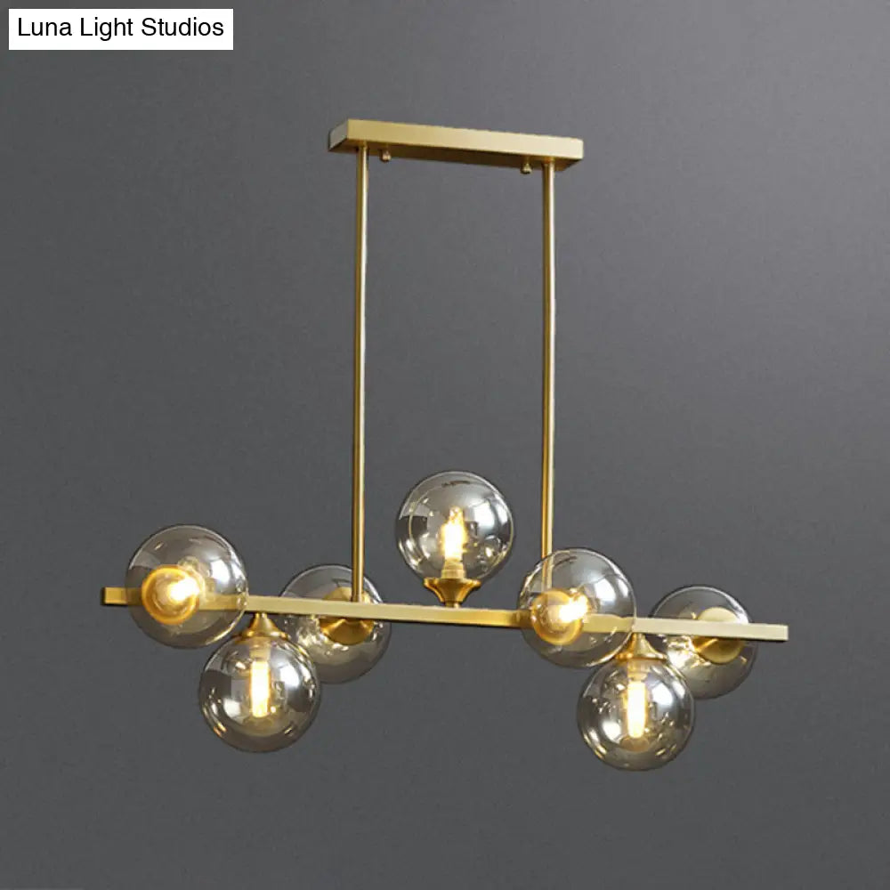 DecorBites™ Mid-Century Modern Gold Metal Pendant with Spherical Amber Glass - Island Ceiling Light for Dining Table