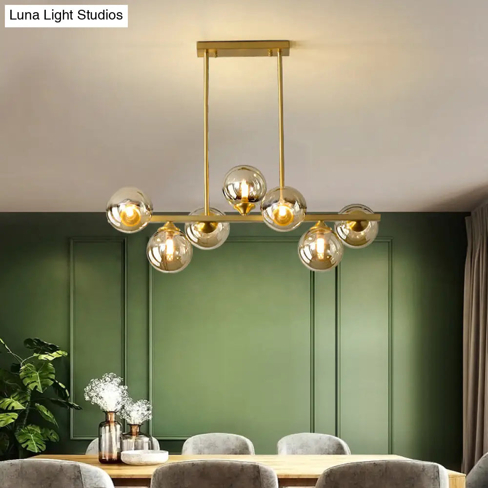 DecorBites™ Mid-Century Modern Gold Metal Pendant with Spherical Amber Glass - Island Ceiling Light for Dining Table