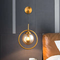 DecorBites™ Modern Brass Wall Sconce with Glass Sphere Shade for Bedside Lighting