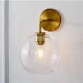 DecorBites™ Modern Glass Orb Wall Sconce with Brass Arm, Clear/White