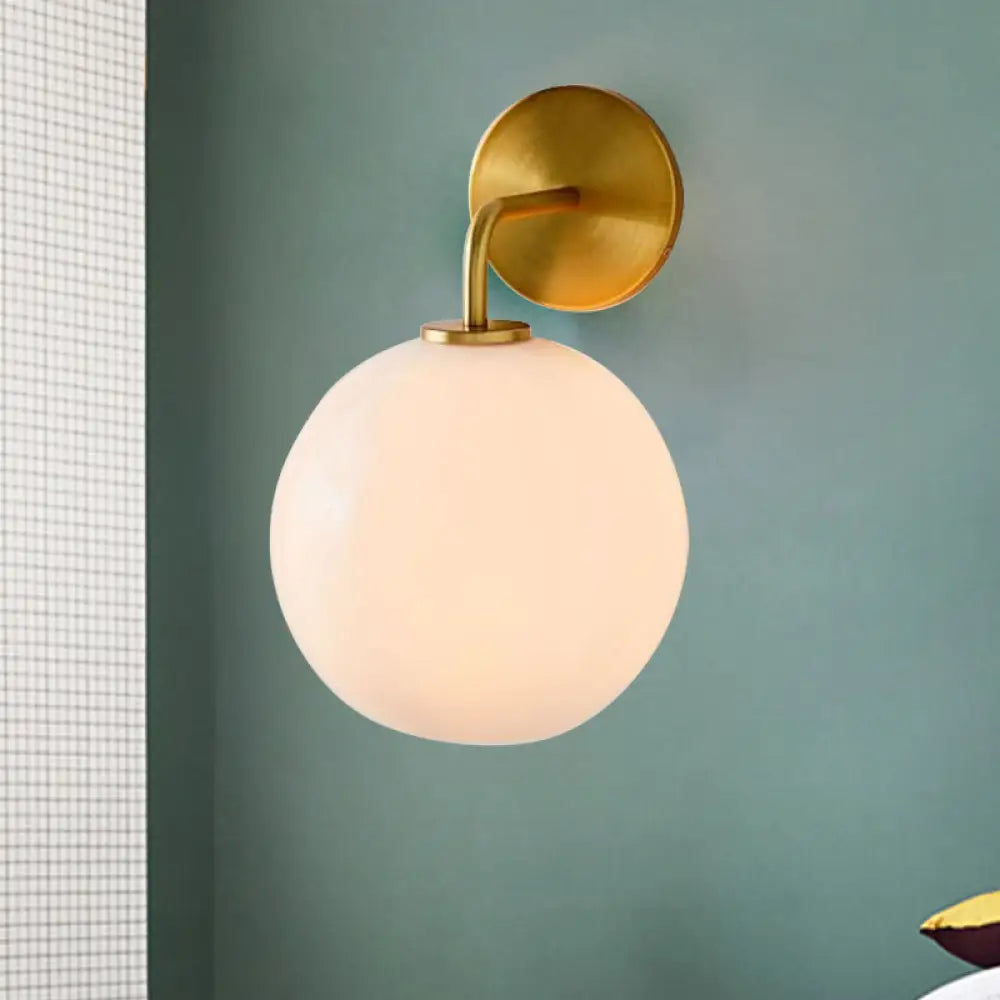 DecorBites™ Modern Glass Orb Wall Sconce with Brass Arm, Clear/White