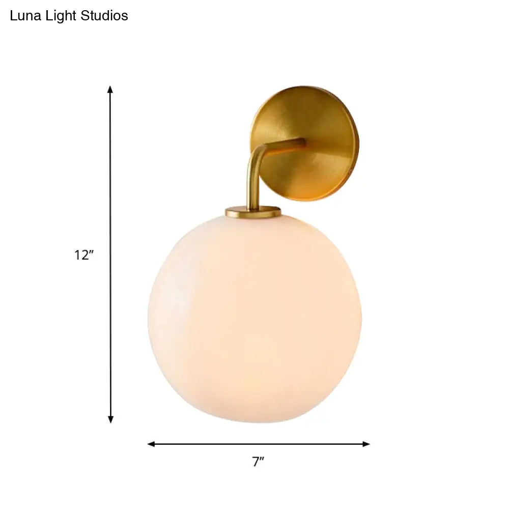 DecorBites™ Modern Glass Orb Wall Sconce with Brass Arm, Clear/White