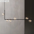 DecorBites™ Modern Minimalism Black Linear 6-Light Island Pendant Lighting with Sphere Glass Shade for Living Room.