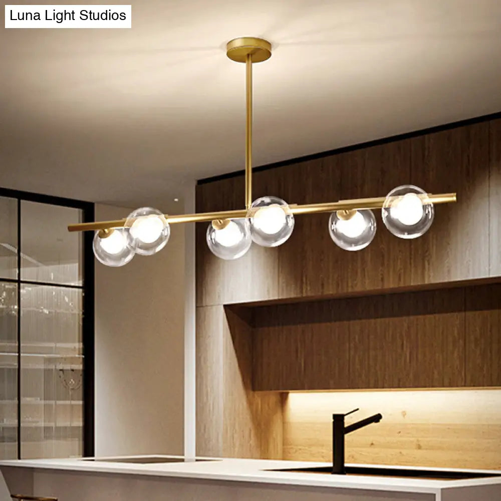 DecorBites™ Nordic Metal 6-Head Linear Island Light with Gold Finish and Clear Glass Globes